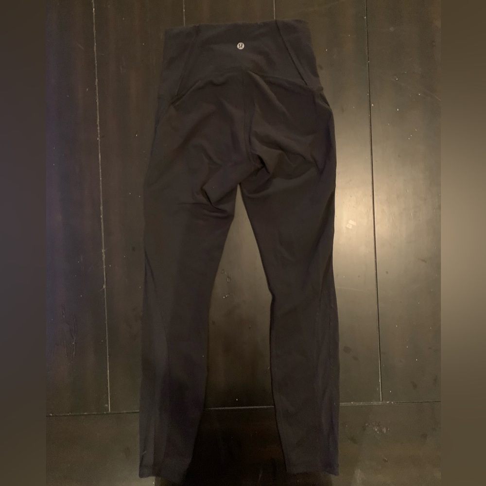 Size 4 black lulu leggings with mesh on the calf area